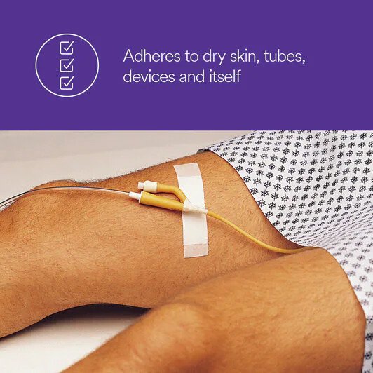 Tape adheres to dry skin, tubes, devices and itself
